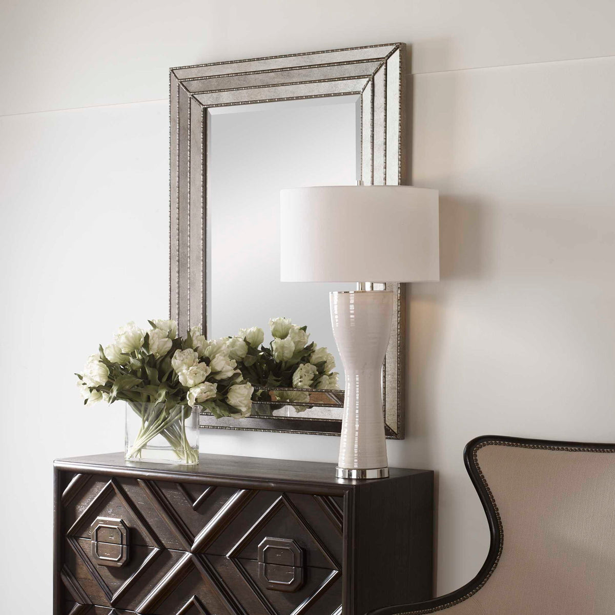 Uttermost Seymour wall mirror in antique silver with a sleek, modern frame and reflective glass, suitable for contemporary decor.