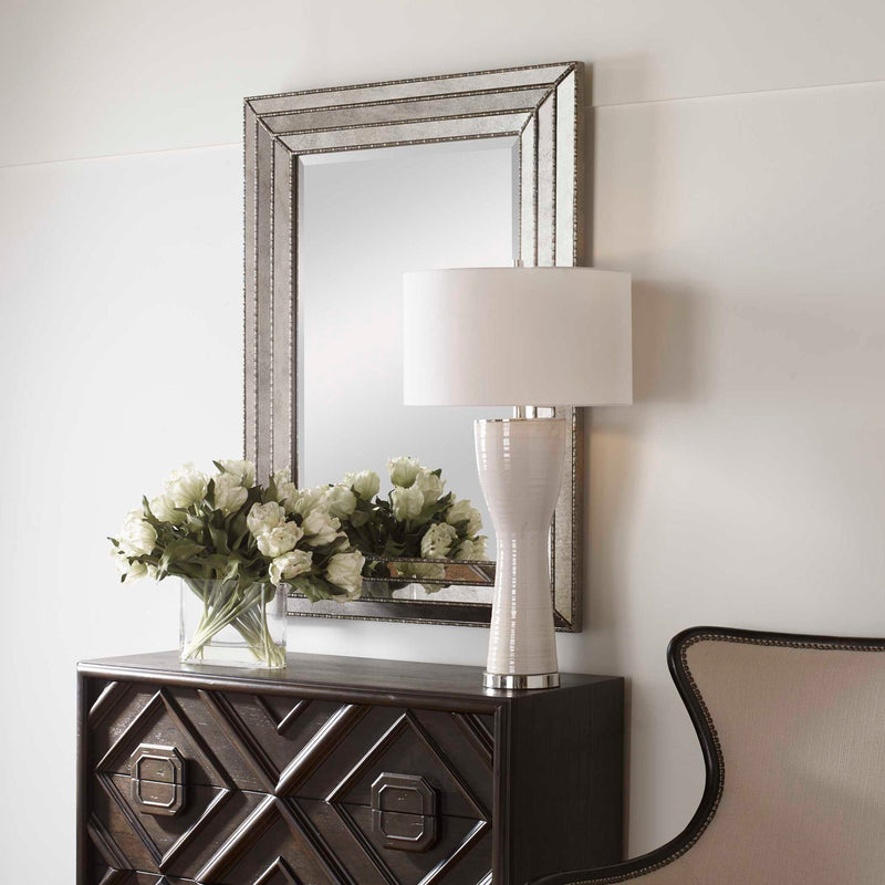 Uttermost Seymour wall mirror in antique silver with a sleek, modern frame and reflective glass, suitable for contemporary decor.