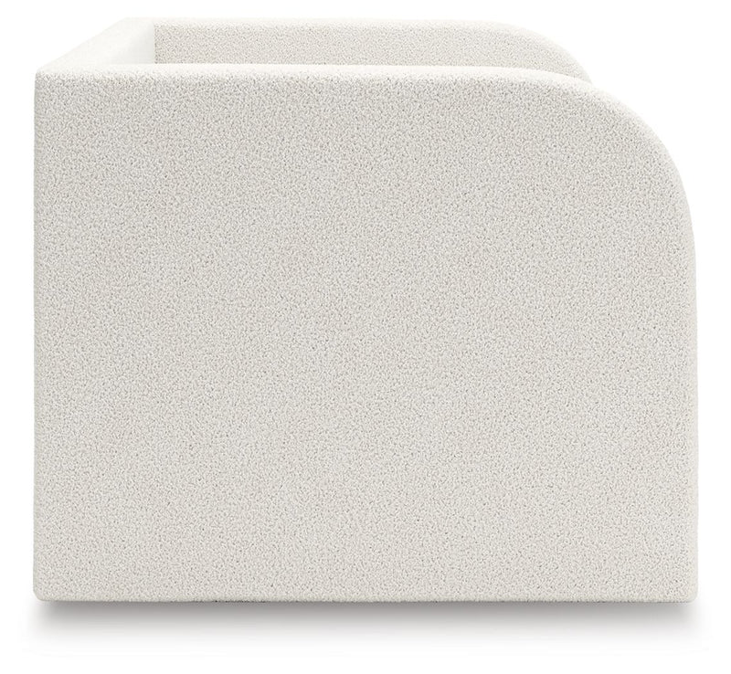 Upholstered day bed from Signature Design by Ashley® with plush cushions and neutral fabric, ideal for lounging or guest sleep.