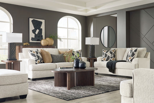 Benchcraft® Heartcort living room set with stationary chair and ottoman, featuring plush upholstery and modern design.