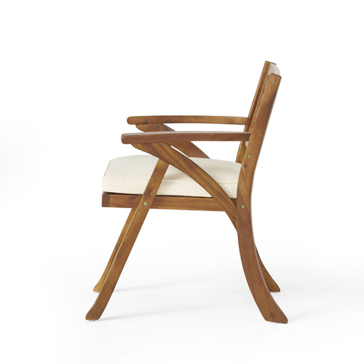 Noble House teak dining chair with water-resistant cushion, showcasing a stylish outdoor seating option with a natural wood finish.