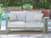 Gray Hurley Park loveseat with plush cushion by Signature Design by Ashley® for comfortable seating and modern home décor.