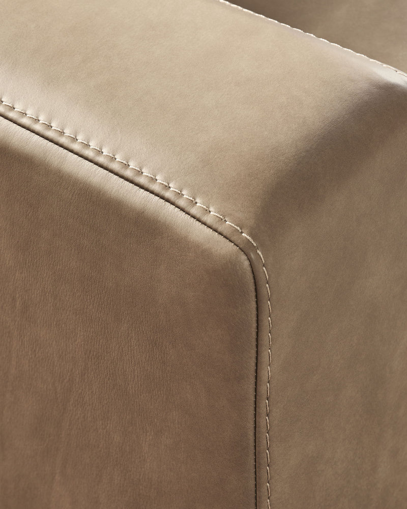 Benchcraft Veronella stationary sectional sofa with plush cushions and modern design in a living room setting.