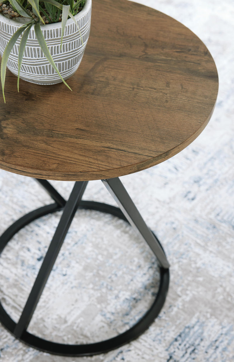 Set of three brown and black Signature Design Ashley Cassbryn occasional tables, modern table set with sleek surfaces.
