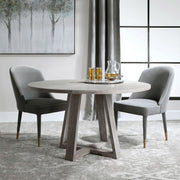 Uttermost Gidran dining table with a sleek wooden surface and modern design, perfect for contemporary dining rooms.