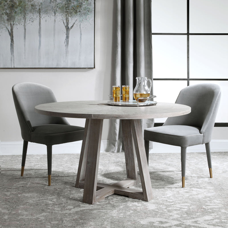 Uttermost Gidran dining table with a sleek wooden surface and modern design, perfect for contemporary dining rooms.