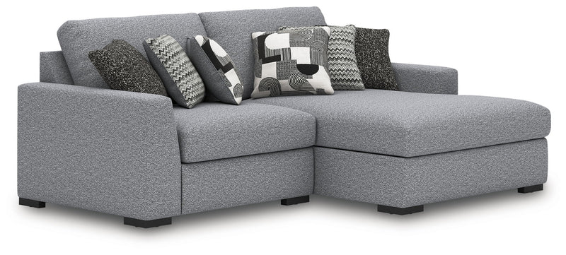 Benchcraft Bealton sectional sofa, a stationary sectional with plush fabric and modern design, shown in a cozy living room setting.