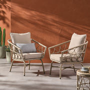 Noble House Bruce outdoor club chair set with brown rattan frames, water-resistant cushions and iron construction for patio relaxation.