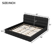 Upholstered platform bed with padded headboard from Dreamland, featuring a modern design and neutral fabric upholstery.