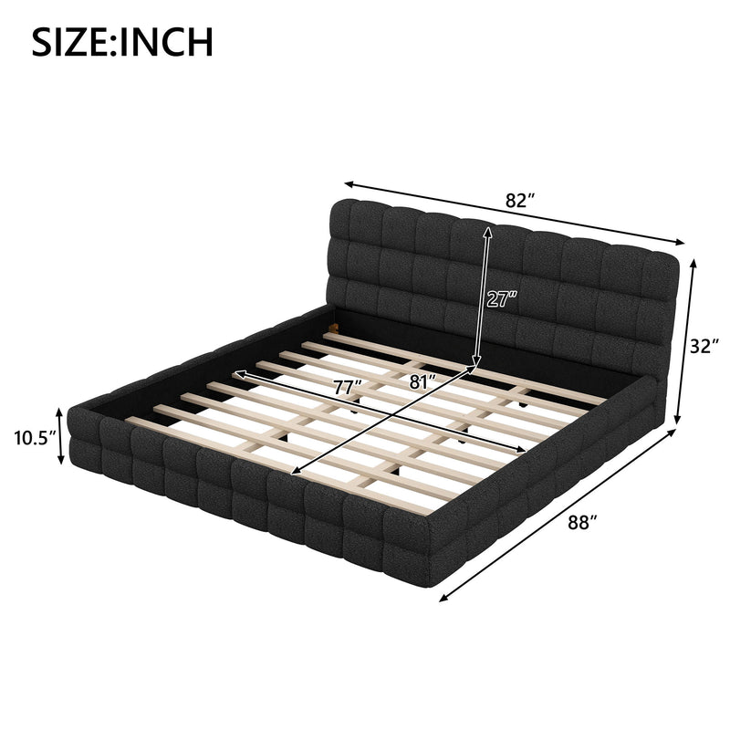 Upholstered platform bed with padded headboard from Dreamland, featuring a modern design and neutral fabric upholstery.