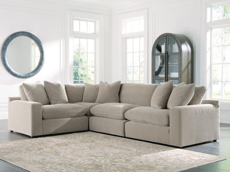 Benchcraft® Maxton Heights stationary sectional sofa with plush cushions and modern design, shown in a spacious living room setting.