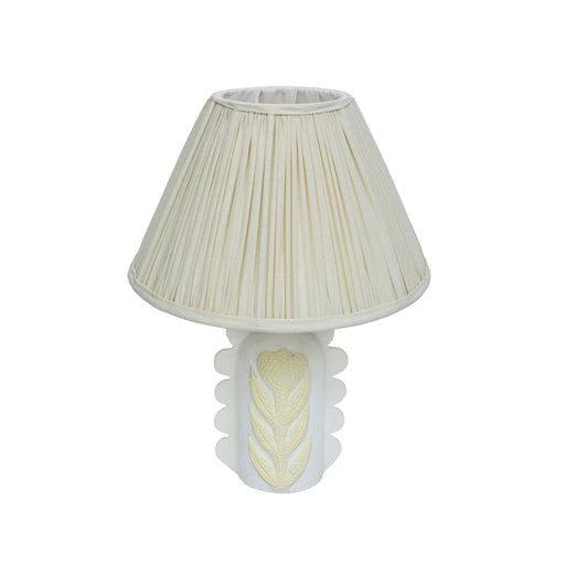 Cream Edith table lamp by TOV Furniture featuring scalloped papier mache flower design and pleated fabric shade.