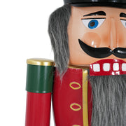 Noble House classic nutcracker holiday decor in green and red, festive Christmas figure standing with a detailed uniform.