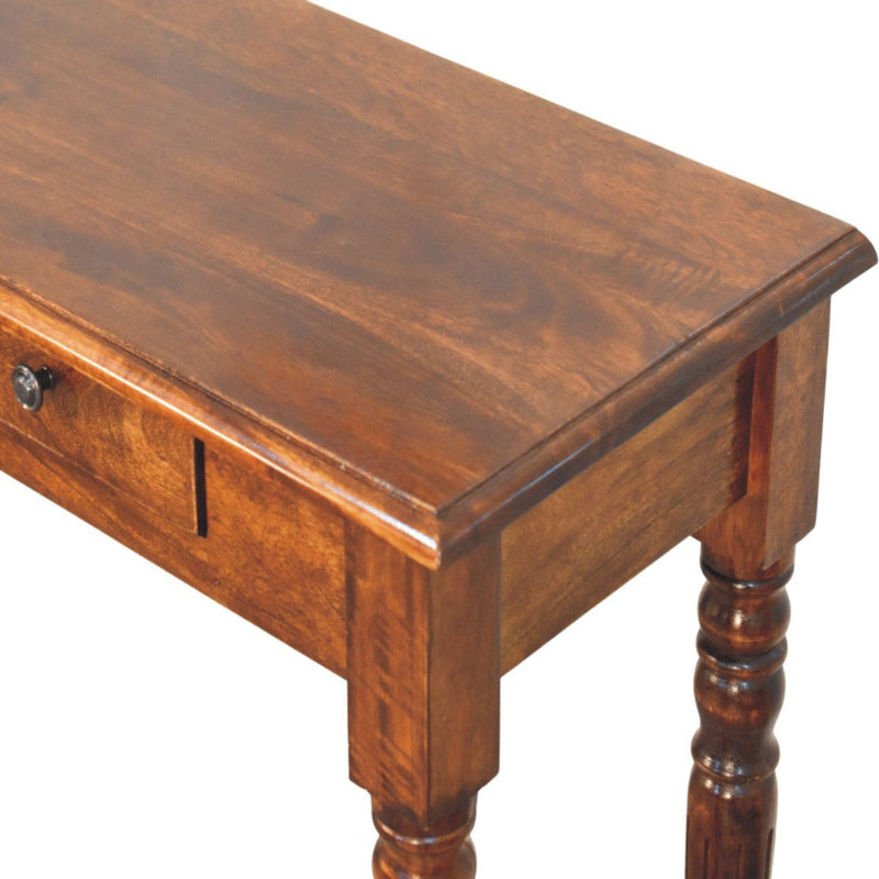 Artisan Furniture turned legs drawer console table with wooden surface and decorative turned leg design for entryway or living room.