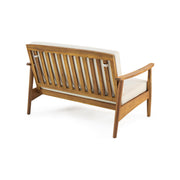 Noble House outdoor acacia wood loveseat set with two seating cushions and a matching coffee table on a patio.