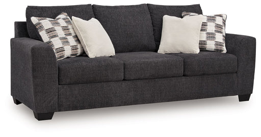 Loreo stationary sofa by Benchcraft®, featuring plush cushions, modern design, and neutral fabric upholstery.