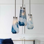 Uttermost Windswept 1-light mini pendant in blue and white glass with a modern, sculptural design for stylish pendant lighting.
