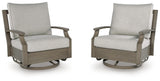 Brown and beige swivel glider chair with cushion from Rainier Ranch by Signature Design Ashley, featuring plush upholstery and a smooth spinning base.