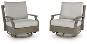 Brown and beige swivel glider chair with cushion from Rainier Ranch by Signature Design Ashley, featuring plush upholstery and a smooth spinning base.