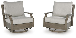 Brown and beige swivel glider chair with cushion from Rainier Ranch by Signature Design Ashley, featuring plush upholstery and a smooth spinning base.