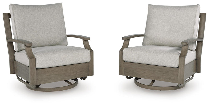 Brown and beige swivel glider chair with cushion from Rainier Ranch by Signature Design Ashley, featuring plush upholstery and a smooth spinning base.