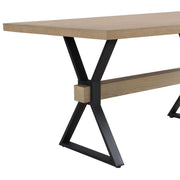 Light ash farmhouse dining table with X-shaped legs by Noble House, showcasing a sturdy wooden surface and rustic design.