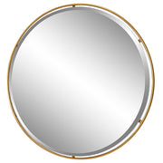 Uttermost Canillo round gold accent mirror with a sleek, modern frame, perfect for contemporary interior decor.