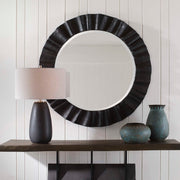 Uttermost Caribou round black accent mirror with a sleek, modern frame, perfect for contemporary wall decor.