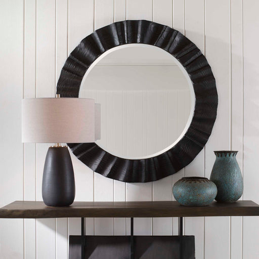 Uttermost Caribou round black accent mirror with a sleek, modern frame, perfect for contemporary wall decor.