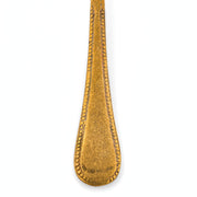 Anuja large brass serving spoon from TOV Furniture, featuring a sleek flatware design and polished finish.