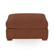 Classic Home Audrey upholstered ottoman with a soft fabric finish, featuring a simple, elegant design for versatile home decor.