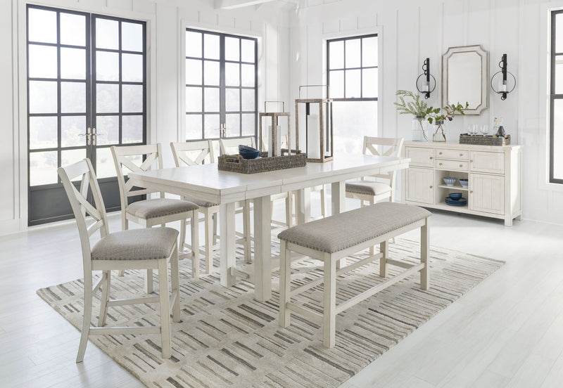 Signature Design by Ashley Robbinsdale rectangular counter height dining table with six matching chairs in a 7-piece set.
