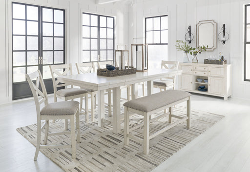 Signature Design by Ashley Robbinsdale rectangular counter height dining table with six matching chairs in a 7-piece set.