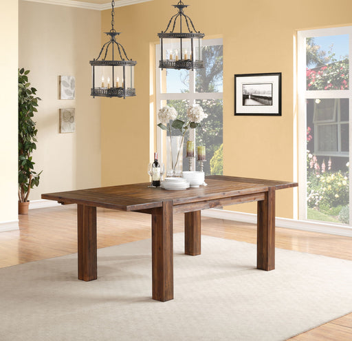 Modus Meadow solid wood extending dining table in brick brown with a composite finish, showcasing its elegant design and extendable feature.