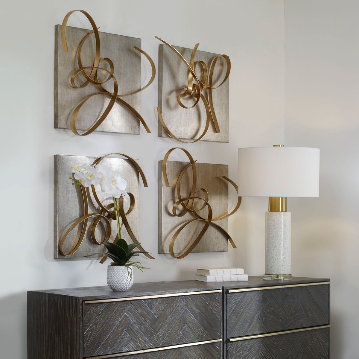Set of two Uttermost gold Harmony metal wall art decor pieces featuring abstract, modern design for stylish home wall decoration.