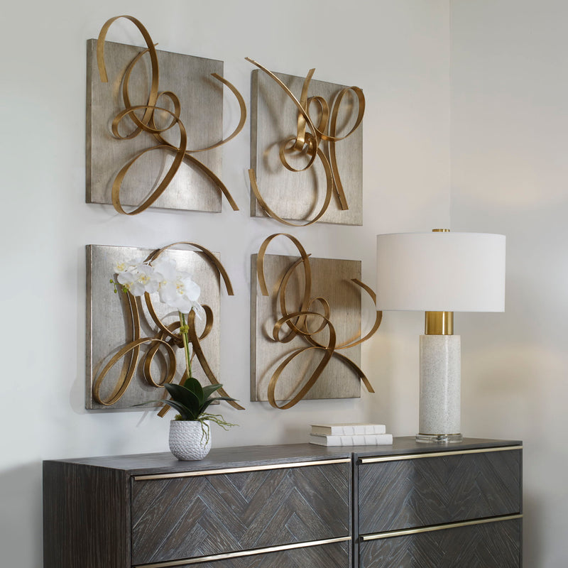 Set of two Uttermost gold Harmony metal wall art decor pieces featuring abstract, modern design for stylish home wall decoration.