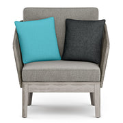 Simpli-Home Carmel outdoor conversation arm chair in Sand Drift color with a cushioned seat and armrests for patio relaxation.