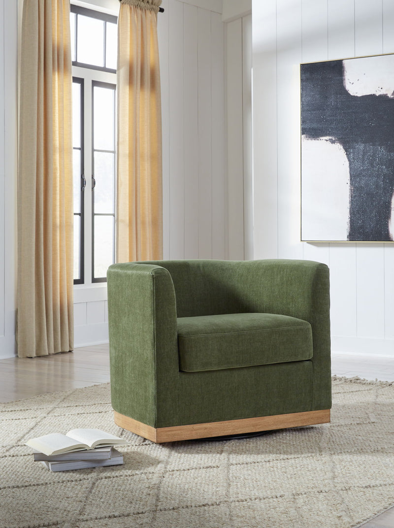 Forest green Jersonlow swivel chair by Signature Design Ashley featuring a cushioned seat and modern design.