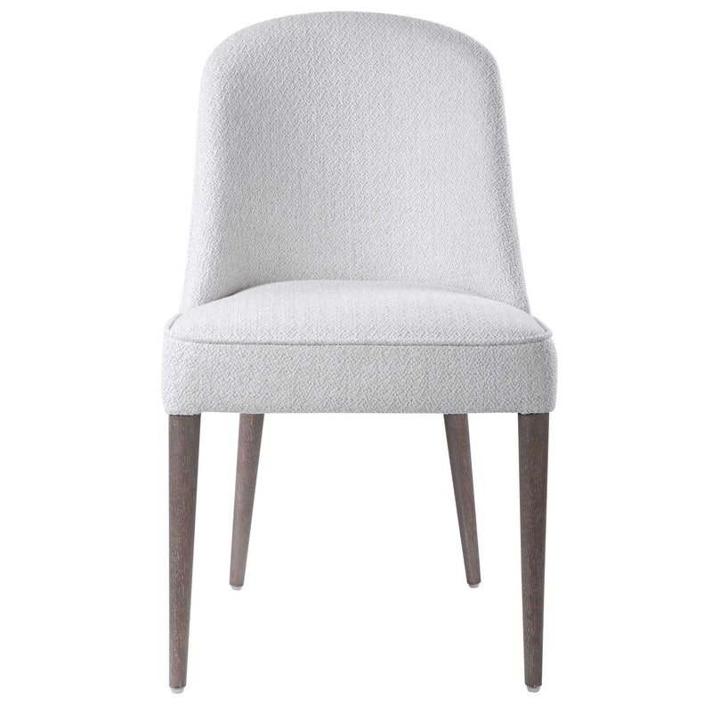 Set of two Uttermost Brie armless chairs with neutral fabric upholstery and wooden legs, modern design for living room decor.