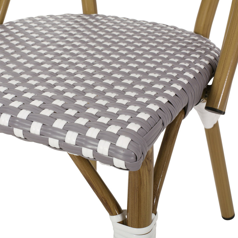 Noble House outdoor rattan and aluminum French bistro chair set with woven rattan seats and sleek metal frames.