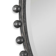 Round iron wall mirror by Uttermost with a sleek, minimalist design and a sturdy metal frame for stylish home decor.