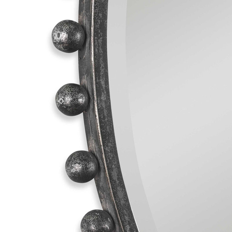 Round iron wall mirror by Uttermost with a sleek, minimalist design and a sturdy metal frame for stylish home decor.