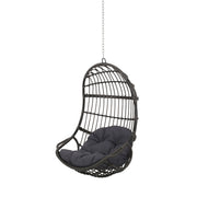 Rustic hanging basket chair with cushion from Noble House, ideal for relaxing indoors or outdoors in a cozy space.