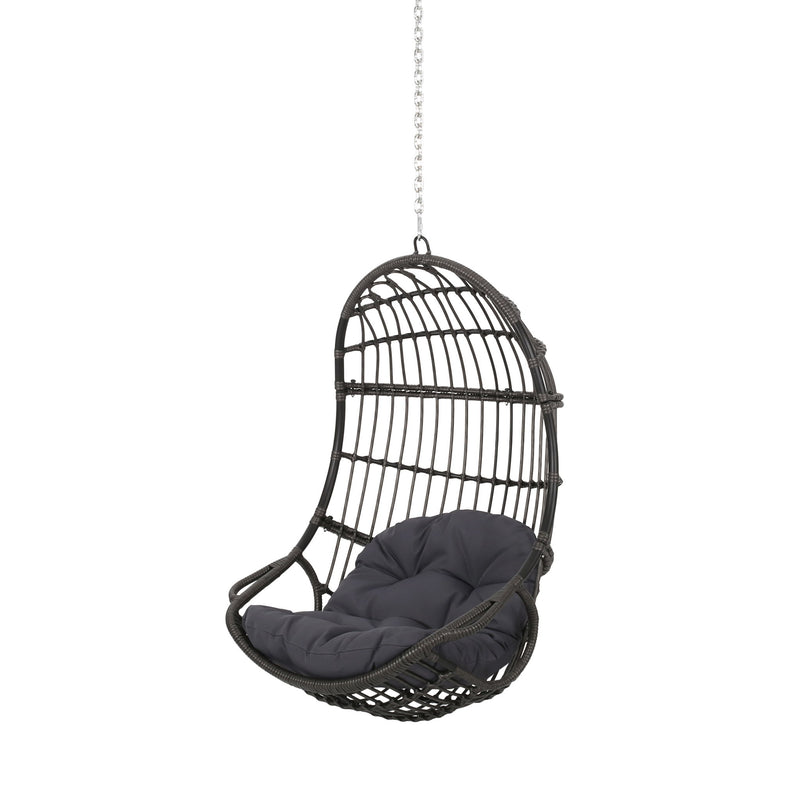 Rustic hanging basket chair with cushion from Noble House, ideal for relaxing indoors or outdoors in a cozy space.