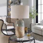 Light brown ceramic table lamp by Uttermost with a smooth, rounded base and a fabric shade for elegant lighting.