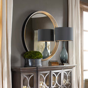 Uttermost Serenza round wall mirror with silver frame, reflecting a modern design for stylish home decor.