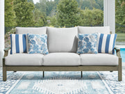 Brown and beige Rainier Ranch sofa with cushions by Signature Design by Ashley, featuring a comfortable, stylish living room setup.