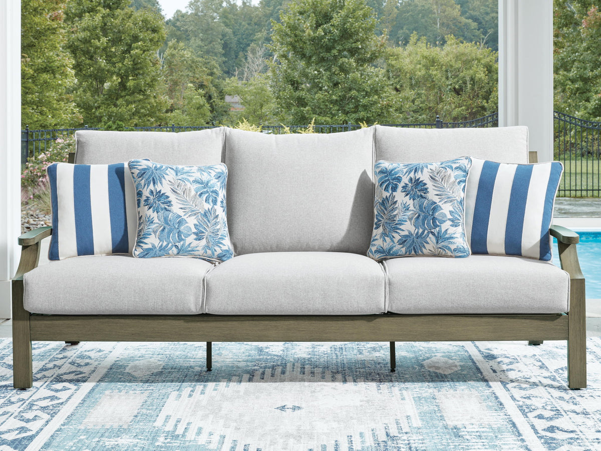 Brown and beige Rainier Ranch sofa with cushions by Signature Design by Ashley, featuring a comfortable, stylish living room setup.