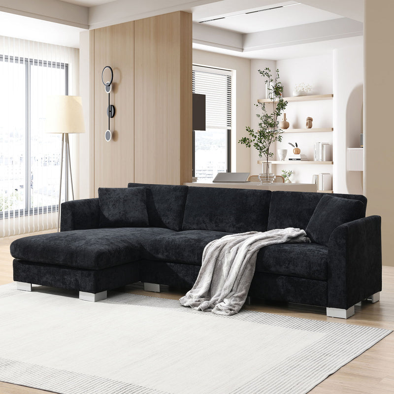 Luxe & Co. modern cloud-shaped L-shaped sectional sofa with oversized chaise, four seats, and two decorative pillows in a stylish living room.