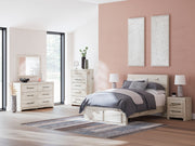 Benchcraft Lawroy 8+ Piece Storage Bedroom Set with beds, dressers, and nightstands arranged in a modern bedroom setting.